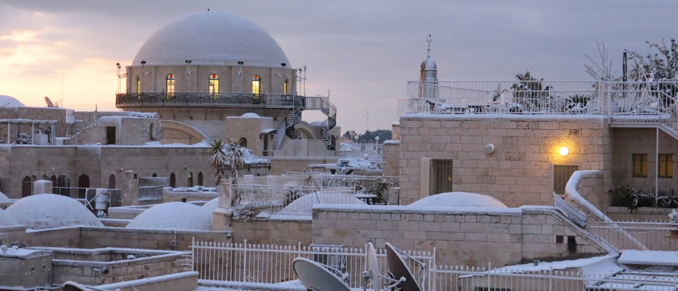 Looking towards Synagogue in Jewish Quarter over snow covere