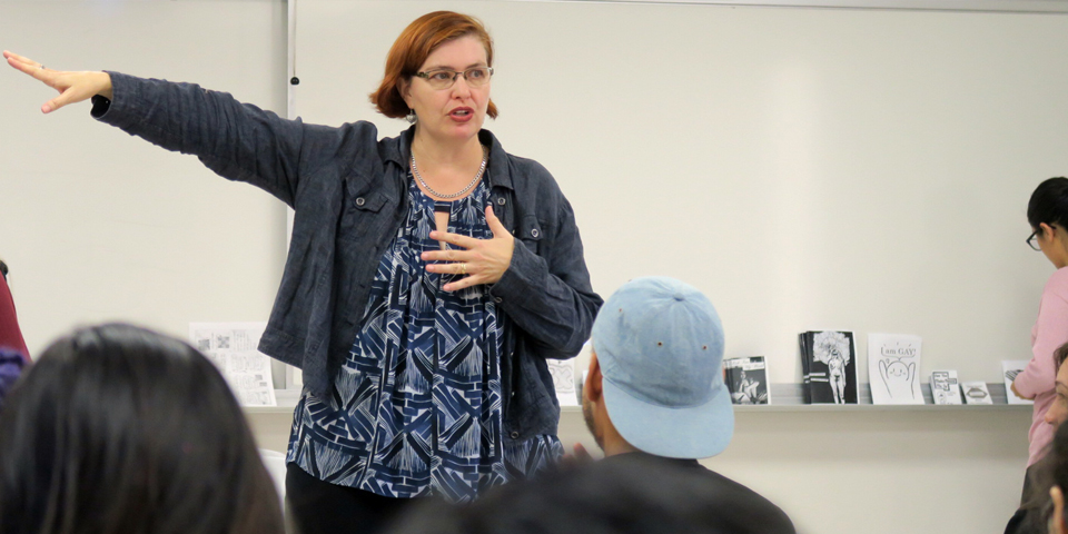 Instructor Points at White Board