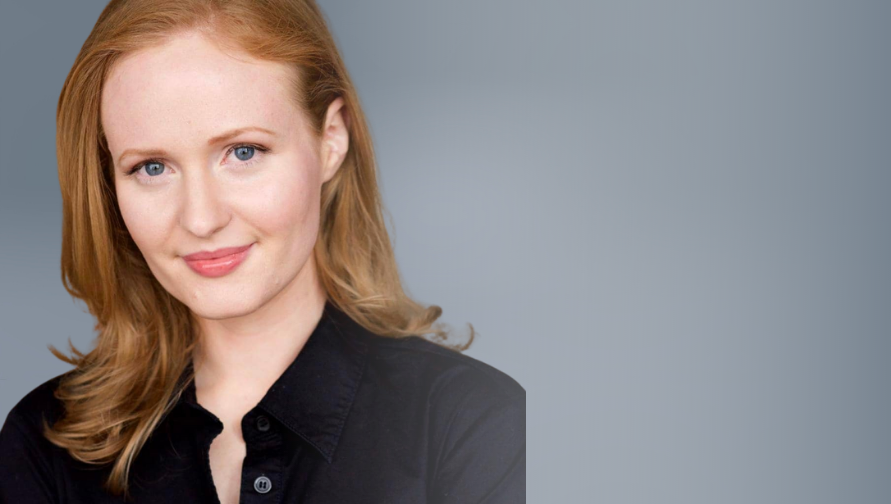 A headshot of Carissa Nihart against a gray background