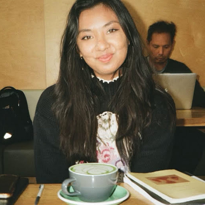 Misha Ponnuraju sits before a matcha latte