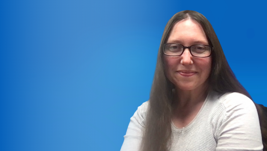 Rebecca Nykwest headshot against a blue background