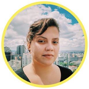 A headshot of Natalia Affonso against a city skyline