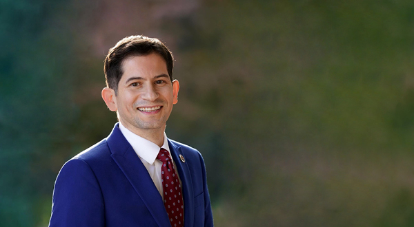 A photo of Saúl Jiménez-Sandoval wearing a dark blue suit