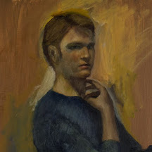 a portrait of a young man with his fingers resting under his chin