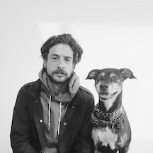 black and white portrait of a man and his dog