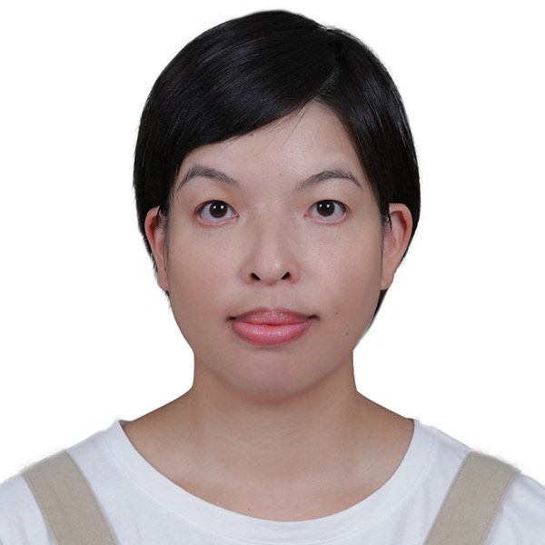 Tsai Yen Lee smiling with a plain white background behind her