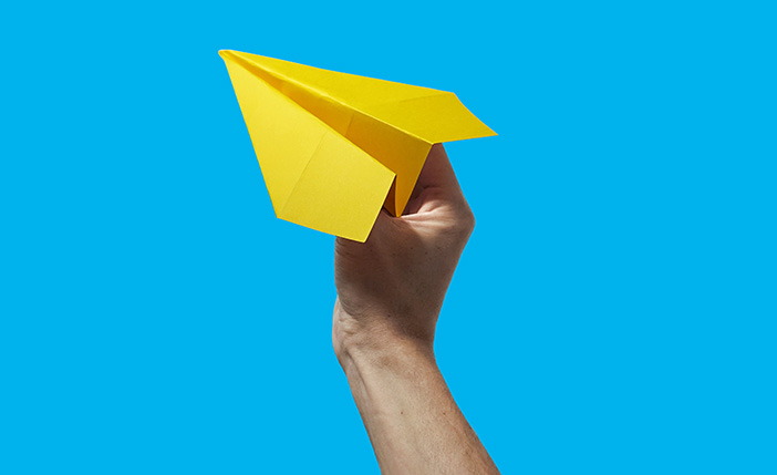 Connect with us - yellow paper airplane