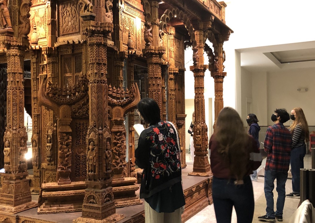 Students explore the wooden temple at the Jain Center of Southern California, Fall 2021