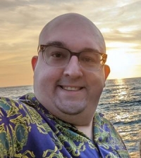 Peter Robert Cibula Iii smiling in front of ocean