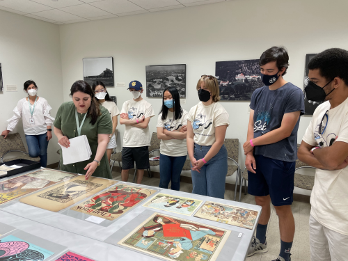 Students looking at pictures during EMA event