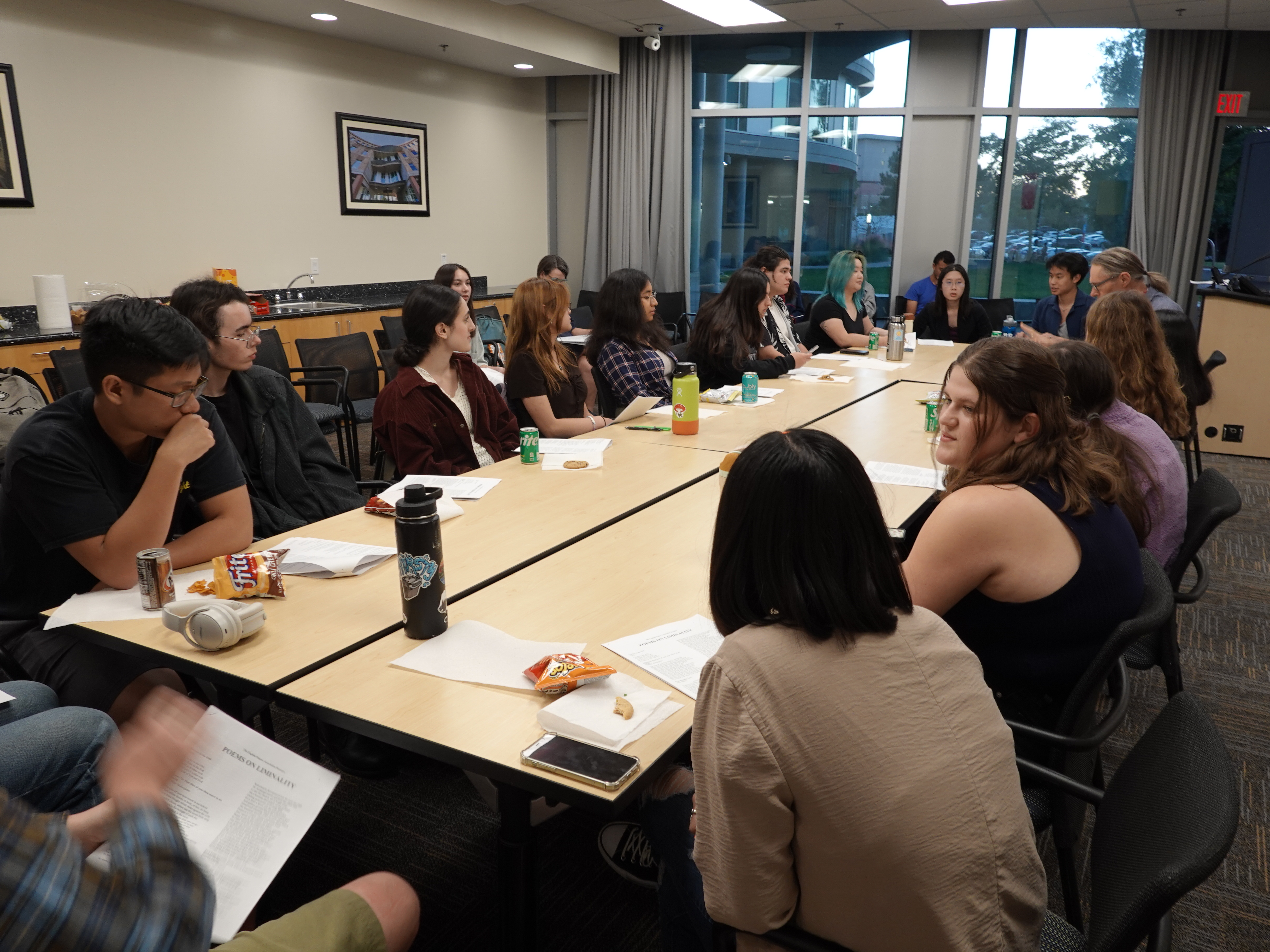 Students gathered around table at English Majors Association event