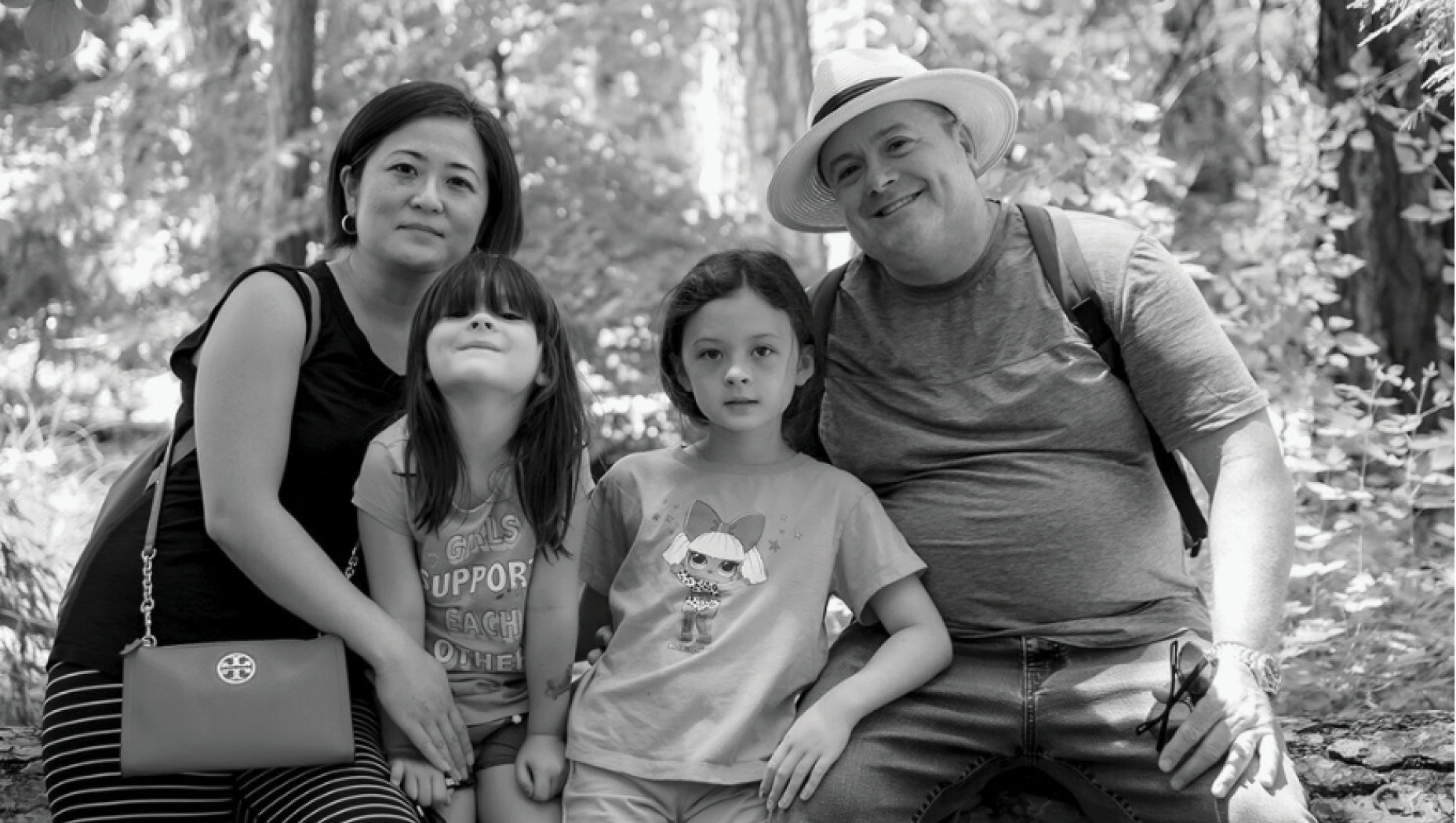 Rodney Hironymous, his wife and two daughters posing for a photo