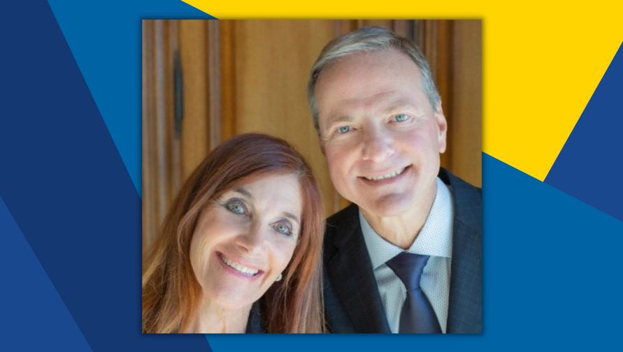 headshot of woman and man smiling