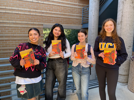 Four Humanities Core students waiting for Jennings to sign their copies of Parable of the Sower.