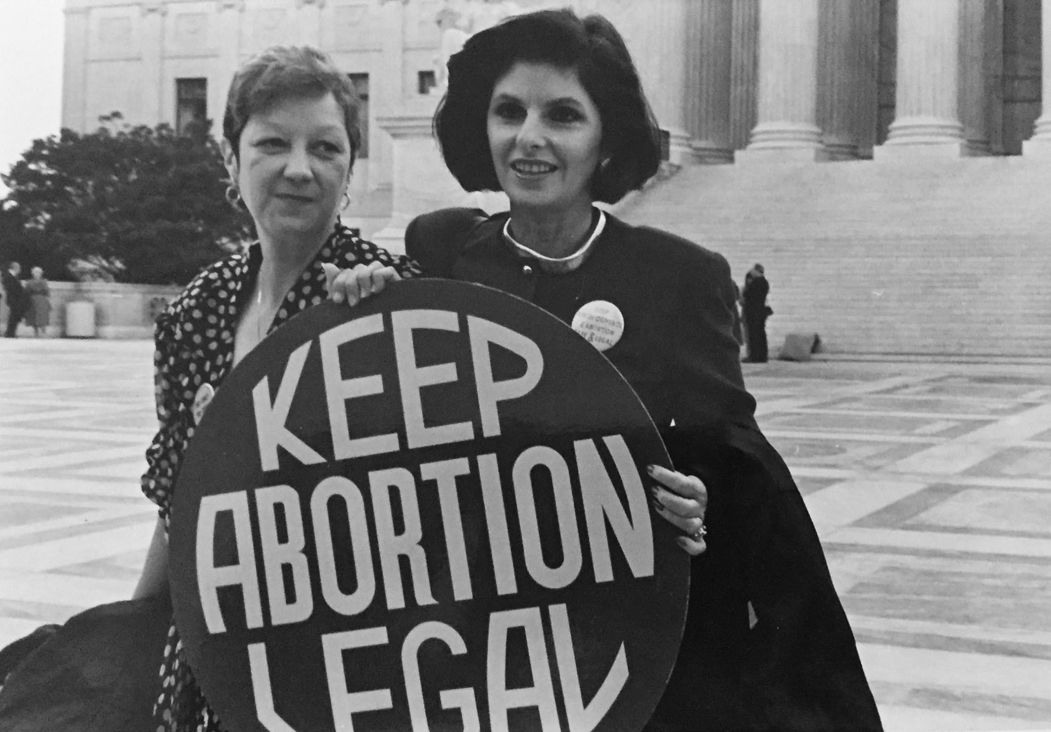 Norma_McCorvey_(Jane_Roe)_and_her_lawyer_Gloria_Allred_on_the_steps_of_the_Supreme_Court,_1989
