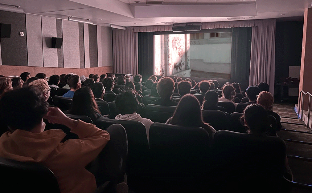 Students watch a film in McCormick Screening Room