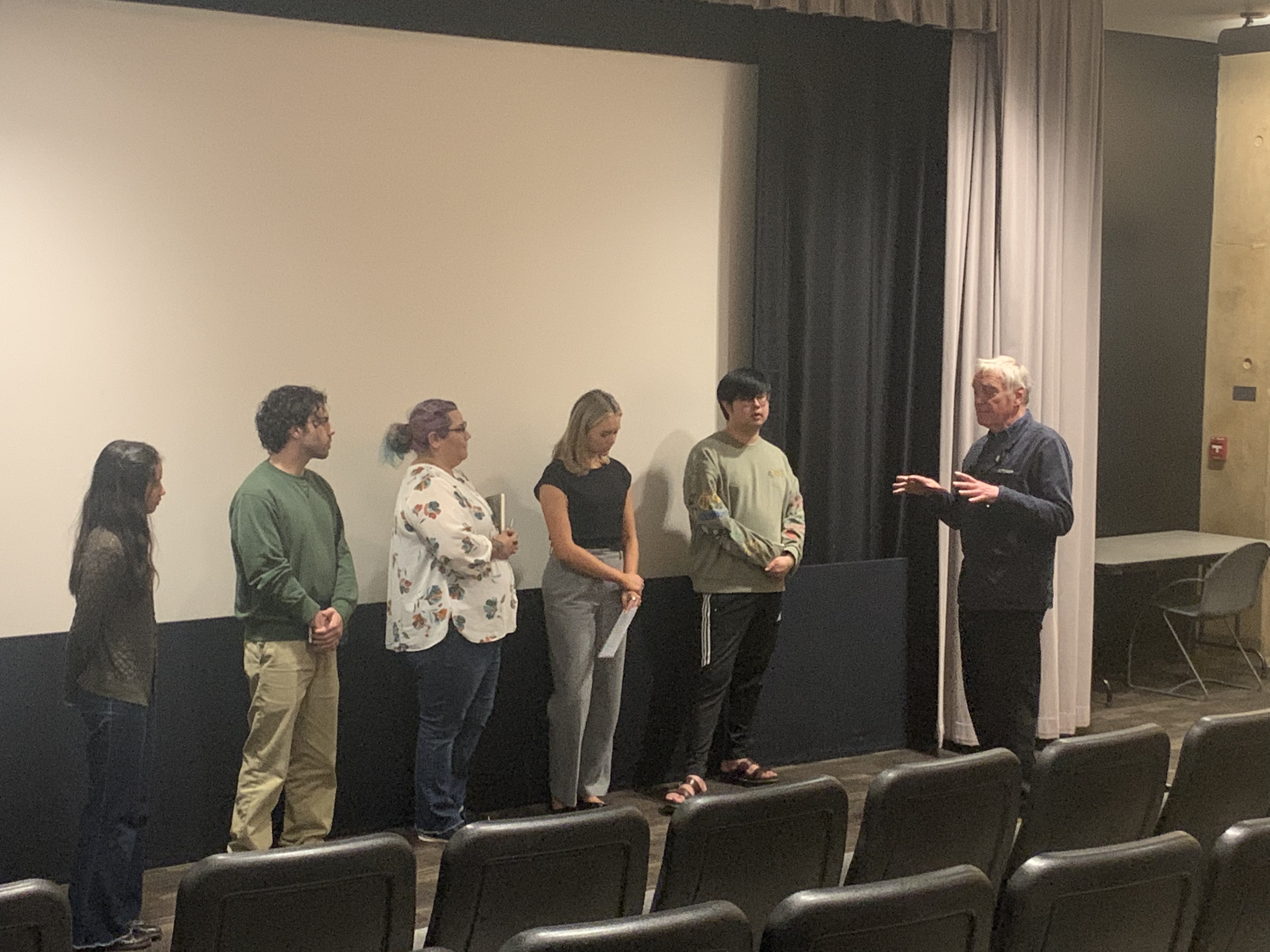Jord den Hollander talks with students.