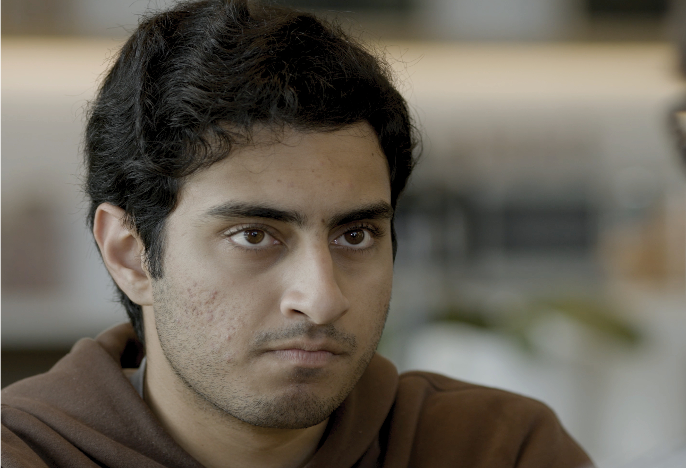A still from the film Unfaithful: A man glares at the camera.