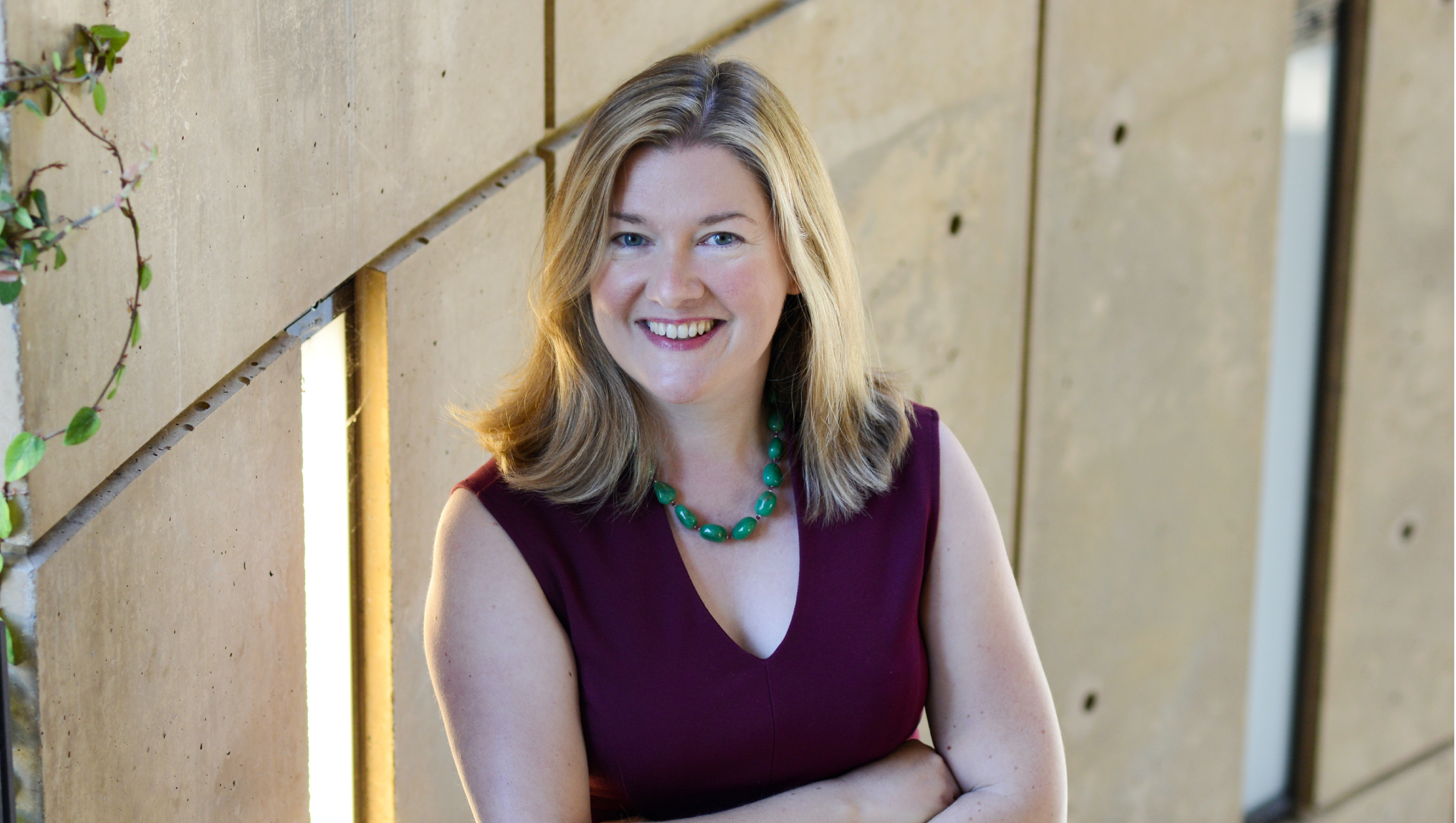 Bernadette Meyler headshot. She is standing with her arms crossed.