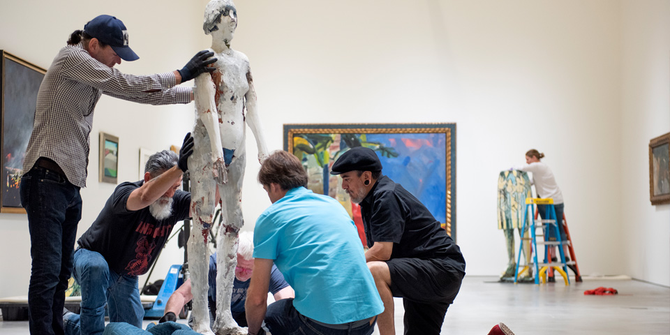 Students work on installation of Buck Collection (IMCA) scul Students install Buck Collection (IMCA) sculpture