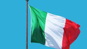 Italian flag against a blue backdrop