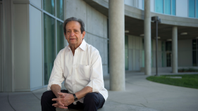 Aijaz Ahmad is at the courtyard of Humanities Gateway, sitting on a bench