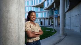 Micherlange Francois-Hemsley stands against a column in Humanities Gateway