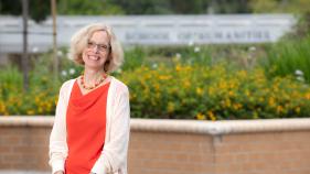 Julia Lupton wears an orange blouse at the School of Humanities courtyard