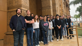 Jain studies students standing in front of a building at the Jain Center of Southern California.