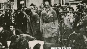 black and white image of Polish Jews scrubbing street overseen by Nazi official