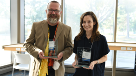 Photo of Jonathan Alexander and Amalia Herrmann with awards