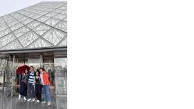 Students at the Louvre pyramid