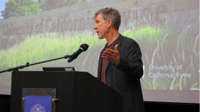 James Steintrager at the Academic Senate awards at the podium accepting his award and giving a speech.