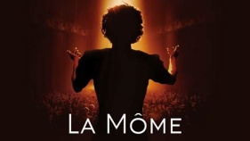 Woman's back singing to an audience