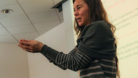 Rachel VanWormer addresses audience in Humanities Gateway.