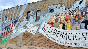 Mural painted on Division Street in the historic Paseo Boricua neighborhood of Humboldt Park, Chicago that reads "Oscar, somos la marejada de la liberación" ("Oscar, We Are the Groundswell of Liberation")