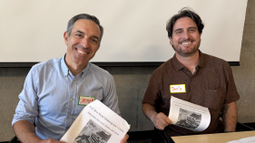 James Cooperider and Danilo Caputo with handouts