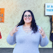 Audrey Casas smiling with both peace signs on her hands