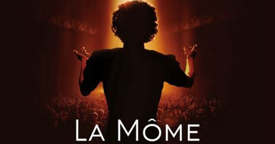 Woman's back singing to an audience