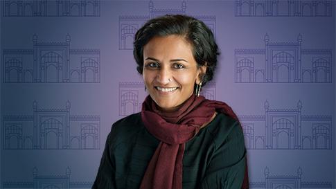 Alka Patel in the foreground, behind an illustration of the Jami Mosque of Khambhat