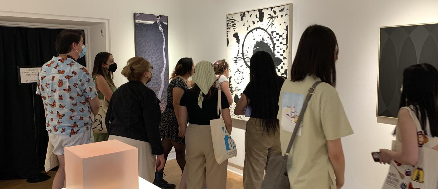 Students looking at a painting