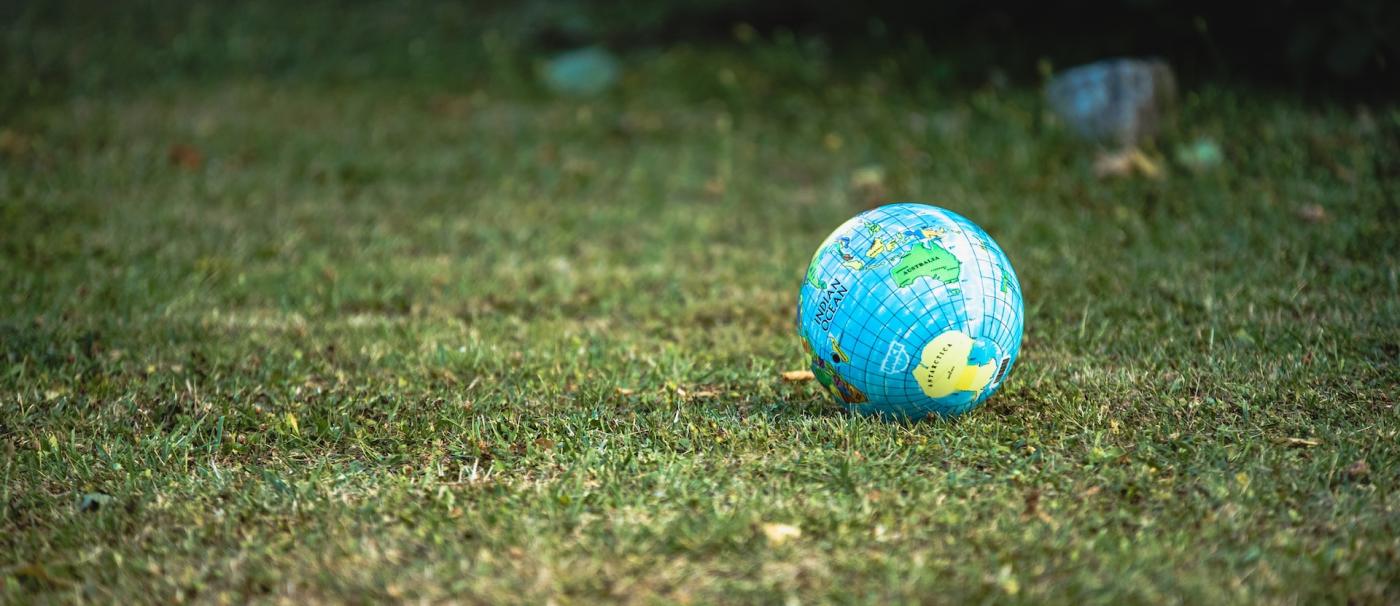 ball with globe sitting on grass