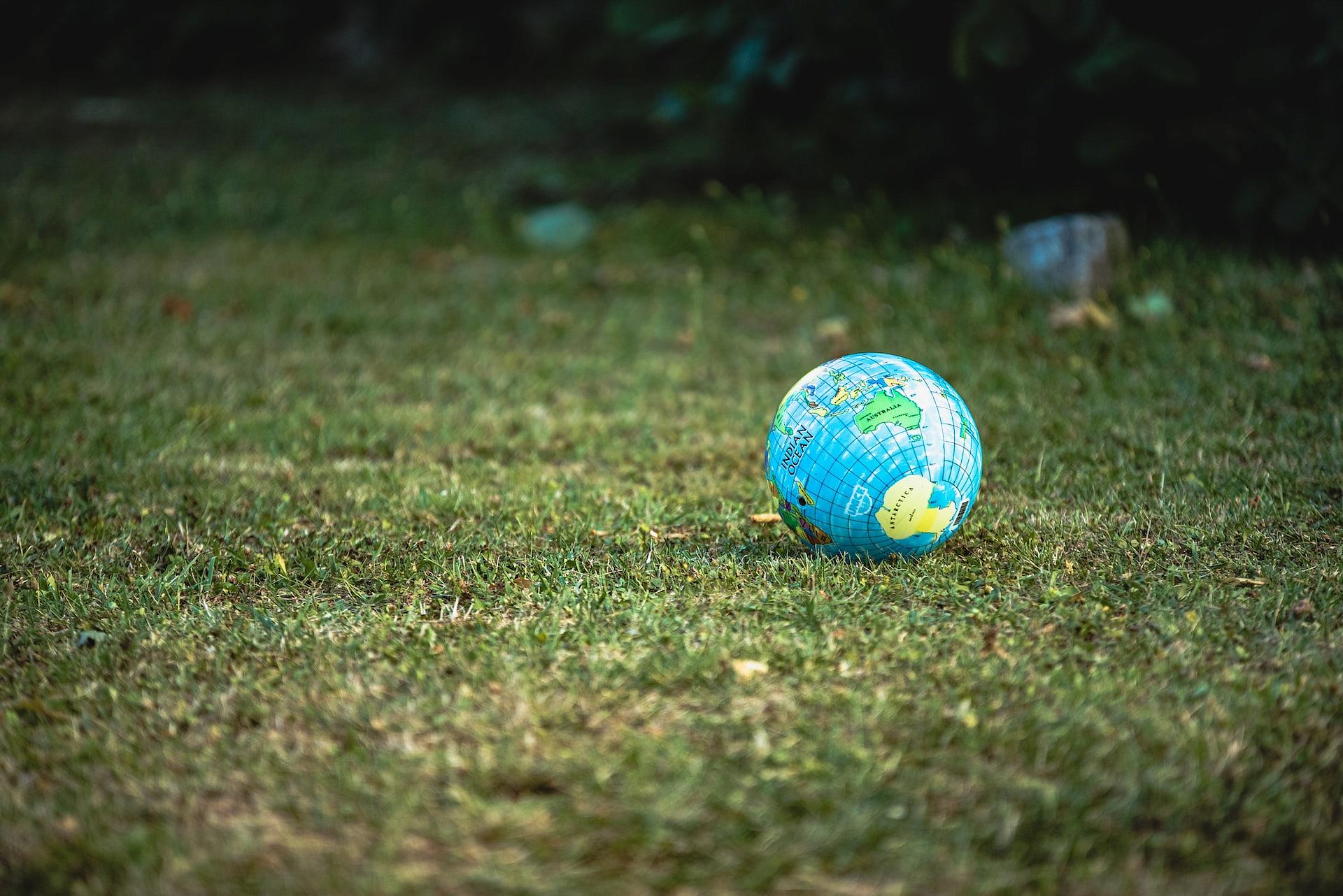 ball with globe sitting on grass