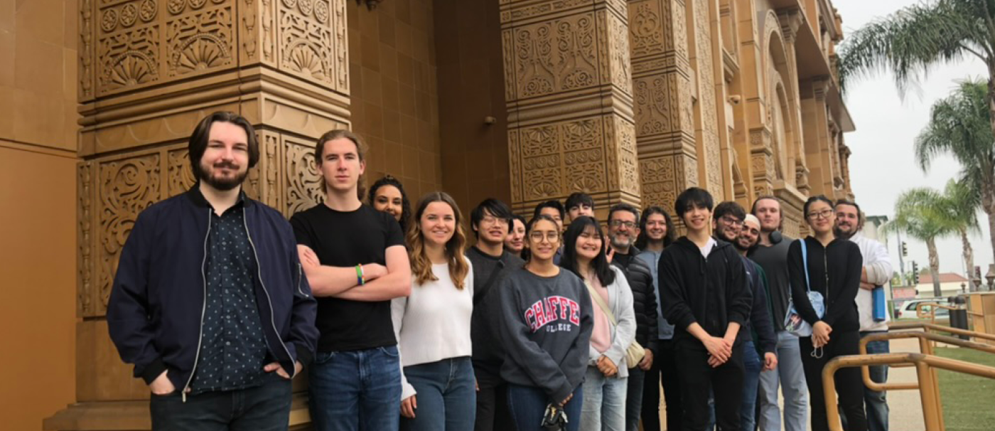 Jain Studies students stand in front of a building at the Jain Center of Southern California.