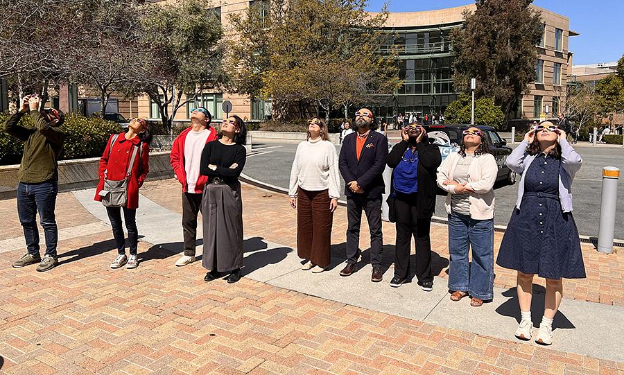 humanities center staff viewing solar eclipse