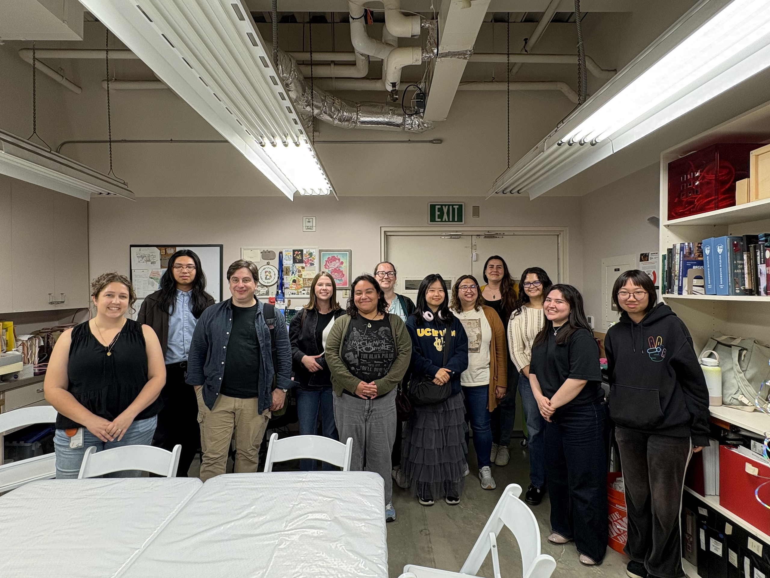 15 people stand together at Bowers Museum on Internship Touring Day.