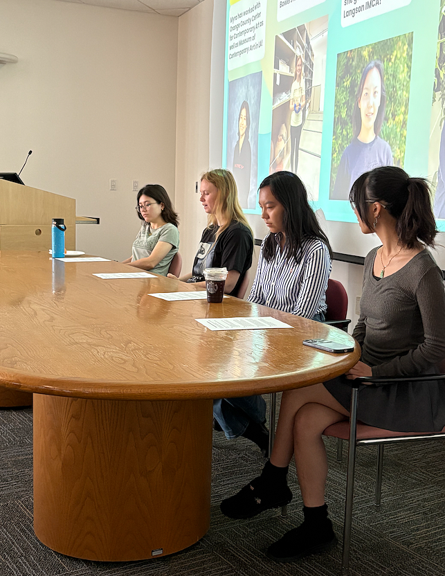 4 undergraduate past interns sit in front of a presentation and discuss internships.