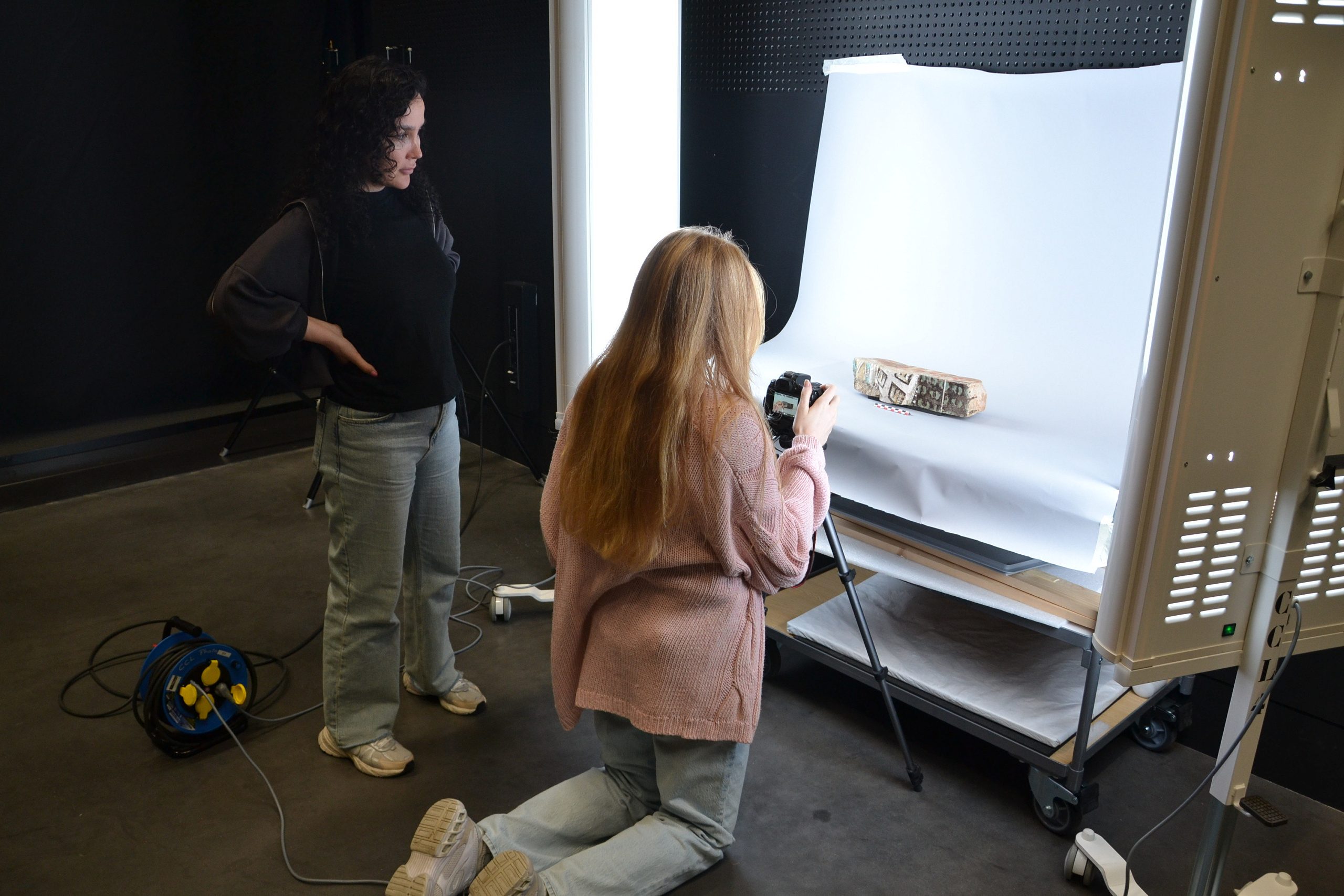 Simin and Amelia photograph a brick.