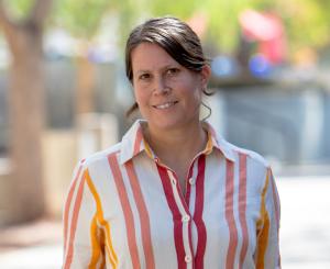 Headshot of woman in striped shirt