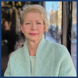 A headshot of Anke Biendarra, she is wearing a light blue sweater.